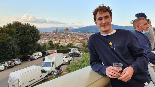 Man on balcony with horizon view