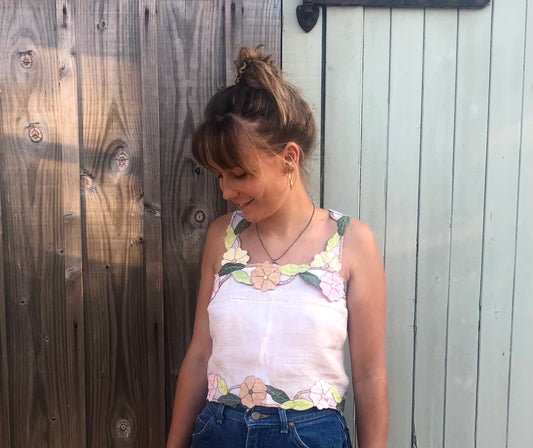 Girl in sustainable 3D floral top 
